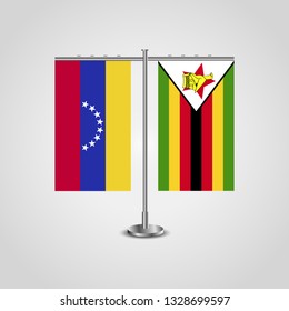 Table stand with flags of Venezuela and Zimbabwe. Two flag. Flag pole. Symbolizing the cooperation between the two countries. Table flags