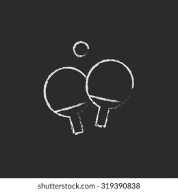 Table tennis racket and ball hand drawn in chalk on a blackboard vector white icon isolated on a black background.