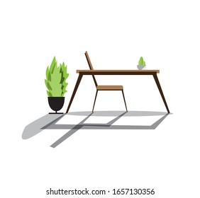Mesas y sillas. Se utiliza para sentarse mientras se come, con decoración de plantas verdes