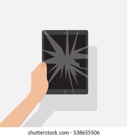 tablet with a cracked screen in a man's hand. Mobile phone is broken.