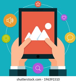 Tablet in hand. Flat style