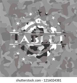 Tablet on grey camouflaged pattern