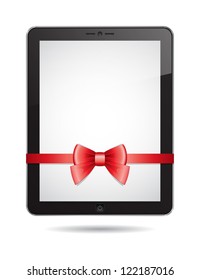 tablet PC with red bow on white background