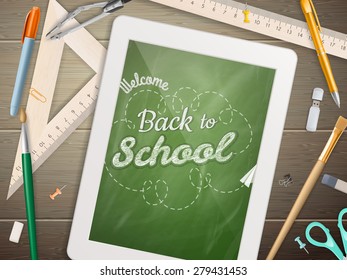 Tablet with a picture of a chalkboard with the sentence back to school written in it, on a rustic wooden desk with pencil different colors. EPS 10 vector file included