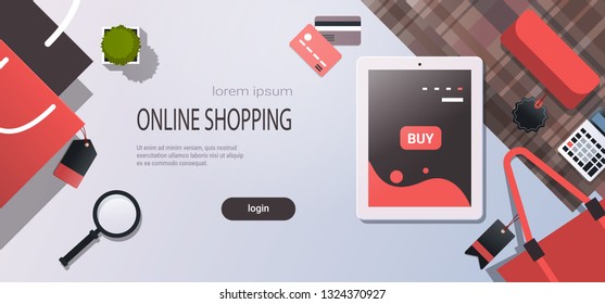 tablet screen sale mobile application online shopping concept workplace desk top angle view office stuff flat copy space horizontal