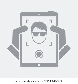 Tablet take a photo to guy