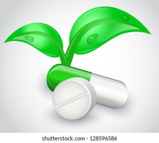 Tablets and capsules on a white background. Capsule of shiny leaves grow