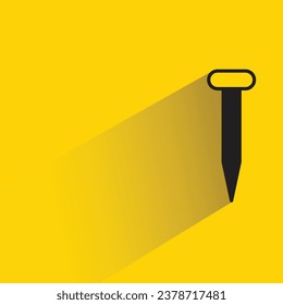 tack and nail with shadow on yellow background