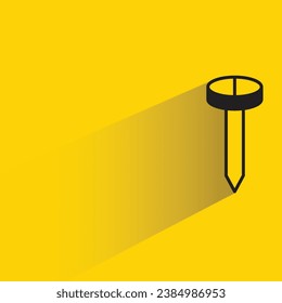 tack and nail with shadow on yellow background