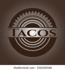 Tacos badge with wooden background