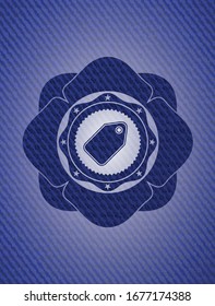 tag icon inside badge with denim background