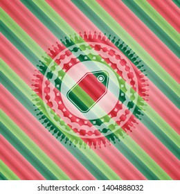tag icon inside christmas badge background.