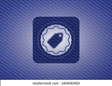 tag icon inside emblem with jean background