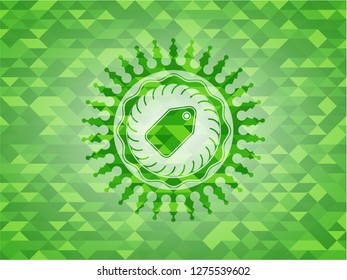 tag icon inside green emblem with triangle mosaic background