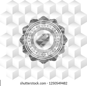tag icon inside grey badge with geometric cube white background