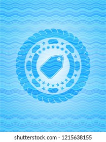 tag icon inside light blue water wave style emblem.