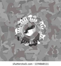 tag icon on grey camo pattern