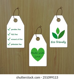 Tag templates on wood background. Can be used for organic products, food and cosmetics. Paraben, PEG, mineral oil, phthalate free. Made with love. Eco friendly.