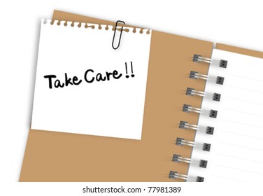 Take care note paper on brown notebook