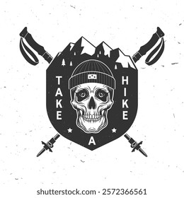 Take a hike. Extreme adventure. Hiking related typographic quote. Concept for shirt or logo, print, stamp. Design with mountain, human skull skeleton in winter hat and hiker pole