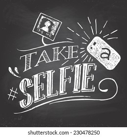 Take a selfie motivation quote hand-lettering on blackboard background with chalk