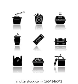 Takeaway food packages drop shadow black glyph icons set. Noodles, bucket of wings. Burger, coffee to go, bar, plastic container. Bag with handles. Isolated vector illustrations on white space