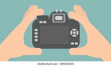 Taking a photo concept. Hands holding a digital camera
