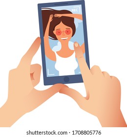 Taking a picture on a smartphone. Online conversation, video conferencing, shoot video on phone. Young beautiful girl smiling. Hands holding smartphone. For your design