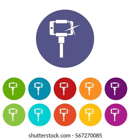 Taking pictures on smartphone on selfie stick set icons in different colors isolated on white background