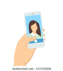 Taking selfie concept, smartphone in a hand with photo on the screen