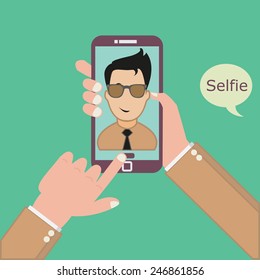 Taking Selfie Photo on Smart Phone concept on green background. 