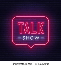 Talk show neon sign on brick wall background.