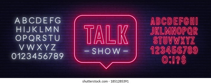 Talk show neon sign on brick wall background.