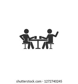 Talking friends at the table icon. Simple glyph vector of friendship set icons for UI and UX, website or mobile application