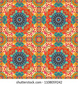 Tangled modern seamless pattern based on traditional patterns. Portuguese tiles in orange, blue and pink colors. Quatrefoil vector pattern.
