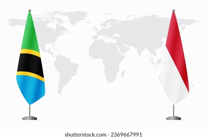 Tanzania and Monaco flags for official meeting against background of world map.