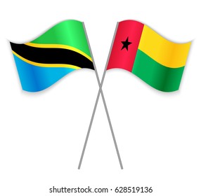 Tanzanian and Bissau-Guinean crossed flags. Tanzania combined with Guinea_Bissau isolated on white. Language learning, international business or travel concept.