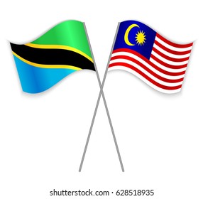 Tanzanian and Malaysian crossed flags. Tanzania combined with Malaysia isolated on white. Language learning, international business or travel concept.