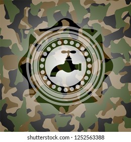 tap icon inside camouflage texture