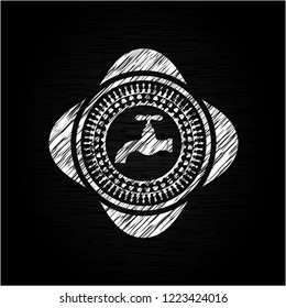 tap icon inside chalk emblem written on a blackboard