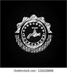 tap icon inside chalk emblem written on a blackboard