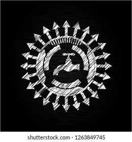 tap icon inside chalkboard emblem on black board