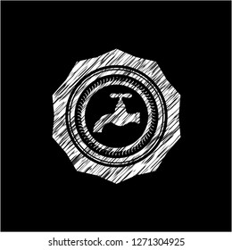 tap icon inside chalkboard emblem on black board