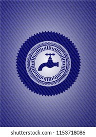 tap icon inside emblem with denim texture