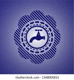 tap icon inside emblem with jean background