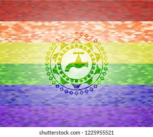 tap icon inside emblem on mosaic background with the colors of the LGBT flag