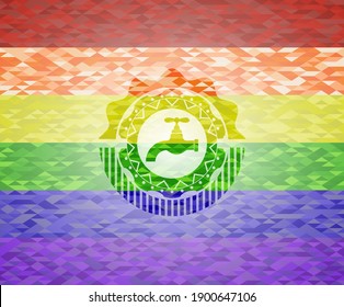 tap icon inside emblem on mosaic background with the colors of the LGBT flag. 