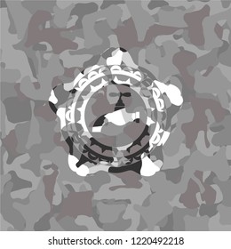 tap icon inside grey camo emblem