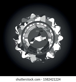 tap icon inside grey camo emblem