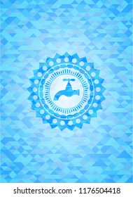 tap icon inside light blue emblem with triangle mosaic background